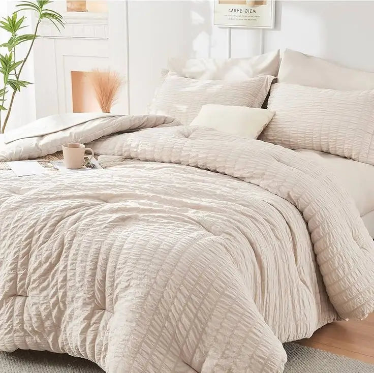Beige textured bedding set with soft quilt and pillows, cozy minimalist bedroom decor for modern home interiors