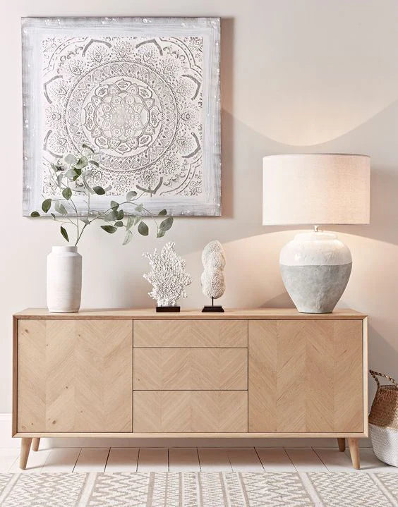 Wooden sideboard with lamp, vases and wall art in neutral tones, elegant minimalist furniture for modern living room