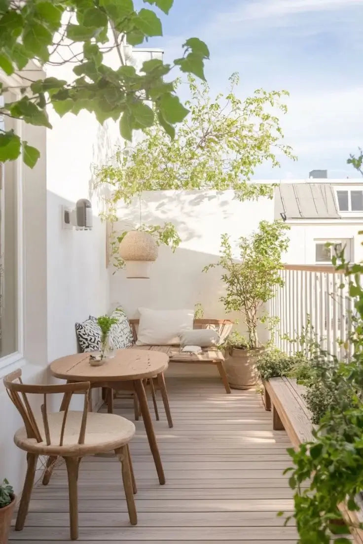 Scandinavian outdoor patio with wooden chairs, small table and greenery, perfect for modern balcony décor inspiration